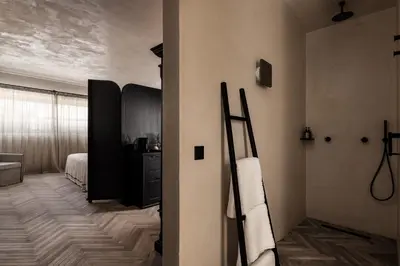 a room with a room with a bed and a bathroom at Abella Suites Embonas in Émbonas