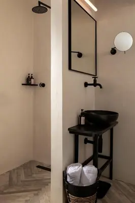 a bathroom with a sink and a mirror at Abella Suites Embonas in Émbonas