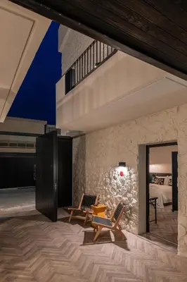 a room with two chairs and a bed at Abella Suites Embonas in Émbonas