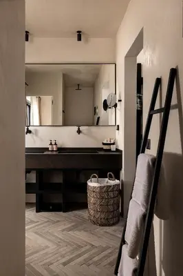 a bathroom with a sink and a large mirror at Abella Suites Embonas in Émbonas