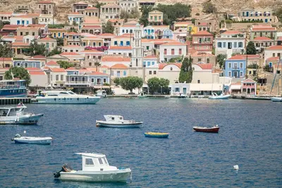 a group of boats in a body of water at Harbour View Modern Apartments with Terrace in Halki