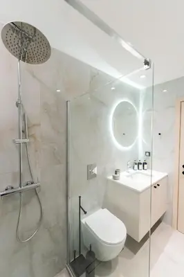 a bathroom with a shower and a toilet and a sink at Alter Ego Cozy Corner in Rhodes Town