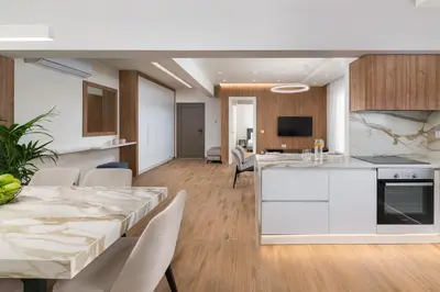 a kitchen and living room with a table and chairs at Onirico Apartment in Rhodes Town