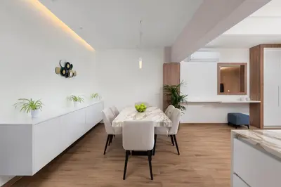 a kitchen and dining room with a table and chairs at Onirico Apartment in Rhodes Town