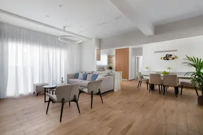 a living room with a couch and a table and chairs at Onirico Apartment in Rhodes Town