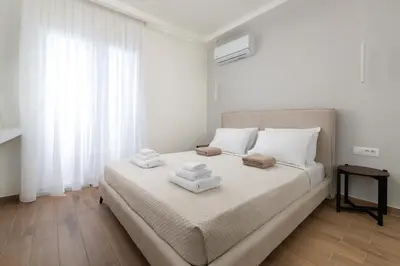 a bedroom with a bed with two towels on it at Onirico Apartment in Rhodes Town