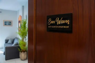 a sign on a door that says sun wives cut career participant at Sunwaves City Center Apartment in Rhodes Town