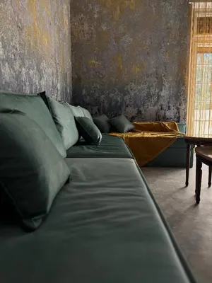 a living room with a couch and a table at Casa Assisi in Rhodes Town