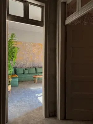 a door leading into a living room with a couch at Casa Assisi in Rhodes Town