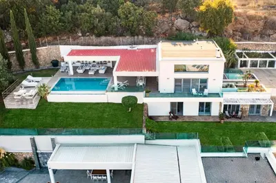 an aerial view of a house with a swimming pool at Luxury Villa Oceania Lindos with Private Infinity Pool in Líndos