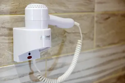 a white phone is plugged into a wall at Elli Garden View in Kremasti