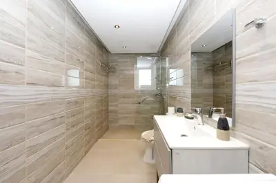 a bathroom with a sink and a toilet at Elli Garden View in Kremasti