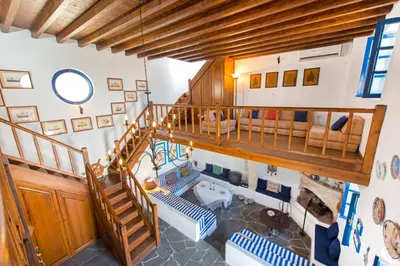 an overhead view of a living room with a staircase at Litsa Holiday Home in Kalathos