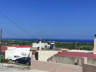 a view from the roof of a house with a car at michaelas traditional house in Phanaes