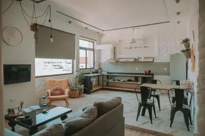 a living room with a couch and a table at mandala central apartment in Rhodes Town