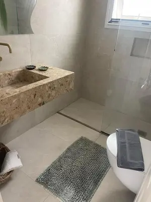 a bathroom with a shower and a toilet and a sink at Luminous Home City Rhodes in Rhodes Town