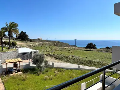 a view of the ocean from the balcony of a house at Erato Sea View Villa in Koskinou