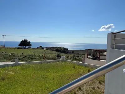 a view of the ocean from a house at Erato Sea View Villa in Koskinou