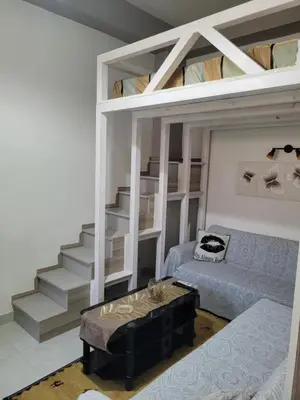 a living room with a loft bed and a couch at Sebastian Luxury House in Rhodes Town