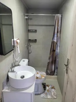 a bathroom with a sink and a toilet at Sebastian Luxury House in Rhodes Town