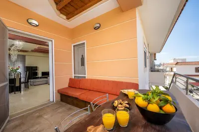 a living room with a couch and fruit on a table at Stavroulas Amazing House in Phanaes