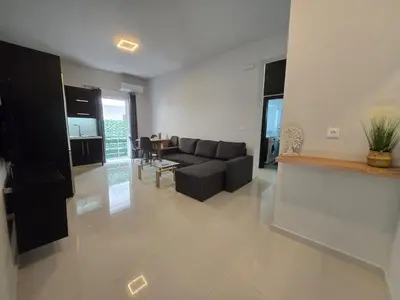 a living room with a couch and a table at Konnet Apartment #2 in Rhodes Town