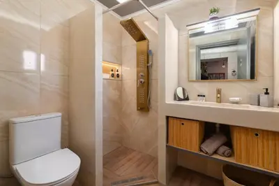 a bathroom with a toilet and a sink and a mirror at Kostas Nest in Ialyssos