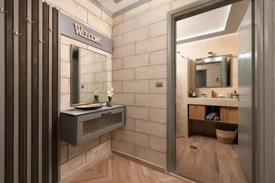 a bathroom with a sink and a mirror at Kostas Nest in Ialyssos