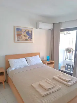 a bedroom with a bed with two towels on it at Apartment in Rhodes town and near the beach in Rhodes Town