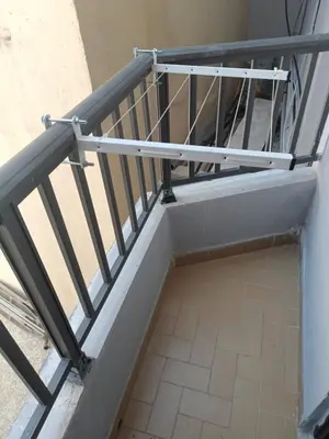 a staircase with a metal railing in a building at Apartment in Rhodes town and near the beach in Rhodes Town