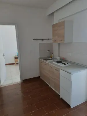 a kitchen with a stove and a white refrigerator at Apartment in Rhodes town and near the beach in Rhodes Town