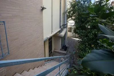 a stairway leading up to a building at Paradise City Apartment in Rhodes Town