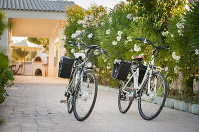 two bikes parked next to each other on a sidewalk at Villa Euphoria in Gennadi