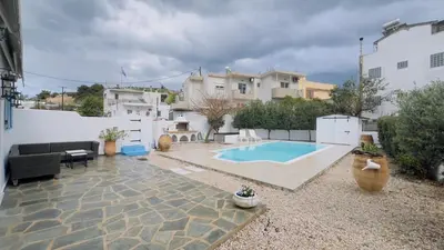 a backyard with a swimming pool and a house at ''TSI TSI' traditional home & private Pool' in Kalithies