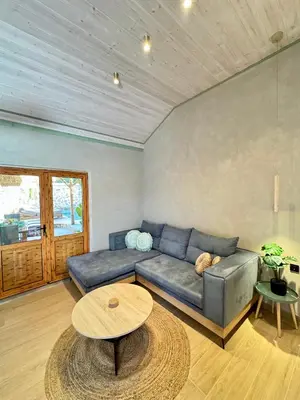 a living room with a couch and a table at City Compass Sunset Villa in Rhodes Town