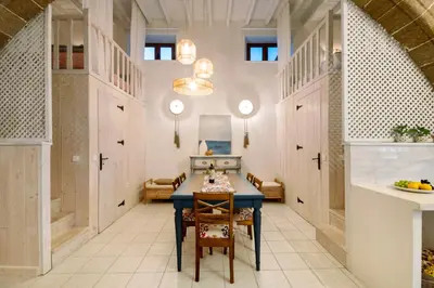 a kitchen with a blue table in a room at Melenia House in Koskinou