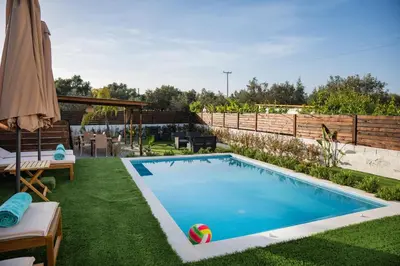 a swimming pool in the backyard of a house at Kathy's apartments in Archaggelos in Archangelos