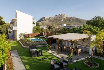 an aerial view of a yard with a pavilion at Kathy's apartments in Archaggelos in Archangelos