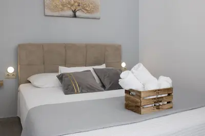 a bedroom with a bed with a box of towels at Cozy studio in Rhodes Town