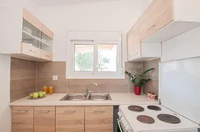 a kitchen with a sink and a counter top at Giannis Place in Arnítha