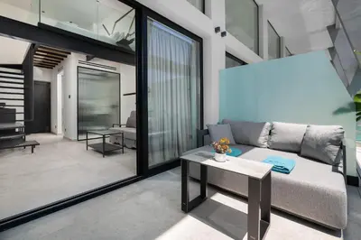 a living room with a couch and a table at Agkyra Hotel in Rhodes Town