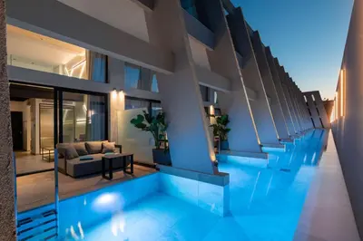 a house with a swimming pool in the middle at Agkyra Hotel in Rhodes Town