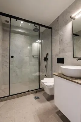 a bathroom with a shower and a toilet and a sink at Rodos Downtown 107 in Rhodes Town