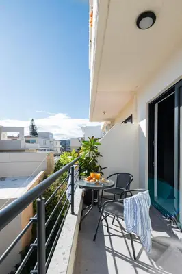 a balcony with a table and chairs on a balcony at Rodos Downtown 107 in Rhodes Town