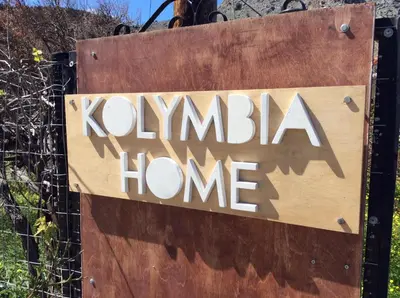 a sign for a kiwiana home at Kolymbia home in Kolimbia
