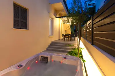 a hot tub on the balcony of a house at Kyma Luxury Apartment in Rhodes Town