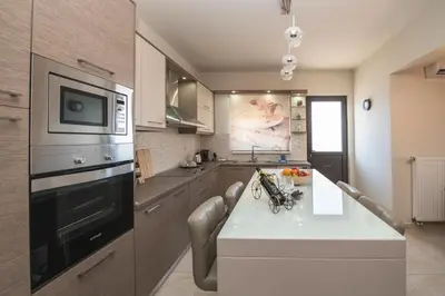 a kitchen with a table and a microwave at Xristina Home in Afantou