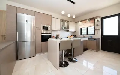 a kitchen with a sink and a refrigerator at Xristina Home in Afantou