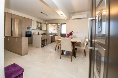 a kitchen and dining room with a table and chairs at Xristina Home in Afantou