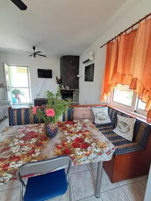 a living room with a table and a couch at Galinis Rooms in Paradeísion